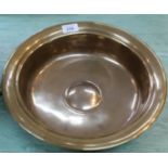 An 18th Century brass bowl with raised central boss,