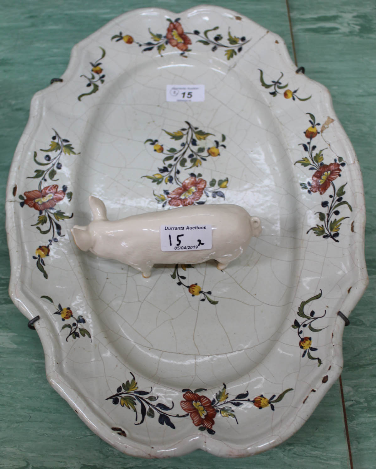 A 19th Century French Faience floral plate plus a Beswick pig,