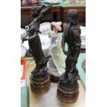 A pair of spelter fisherman and woman figures plus a Leonardo Society Bell