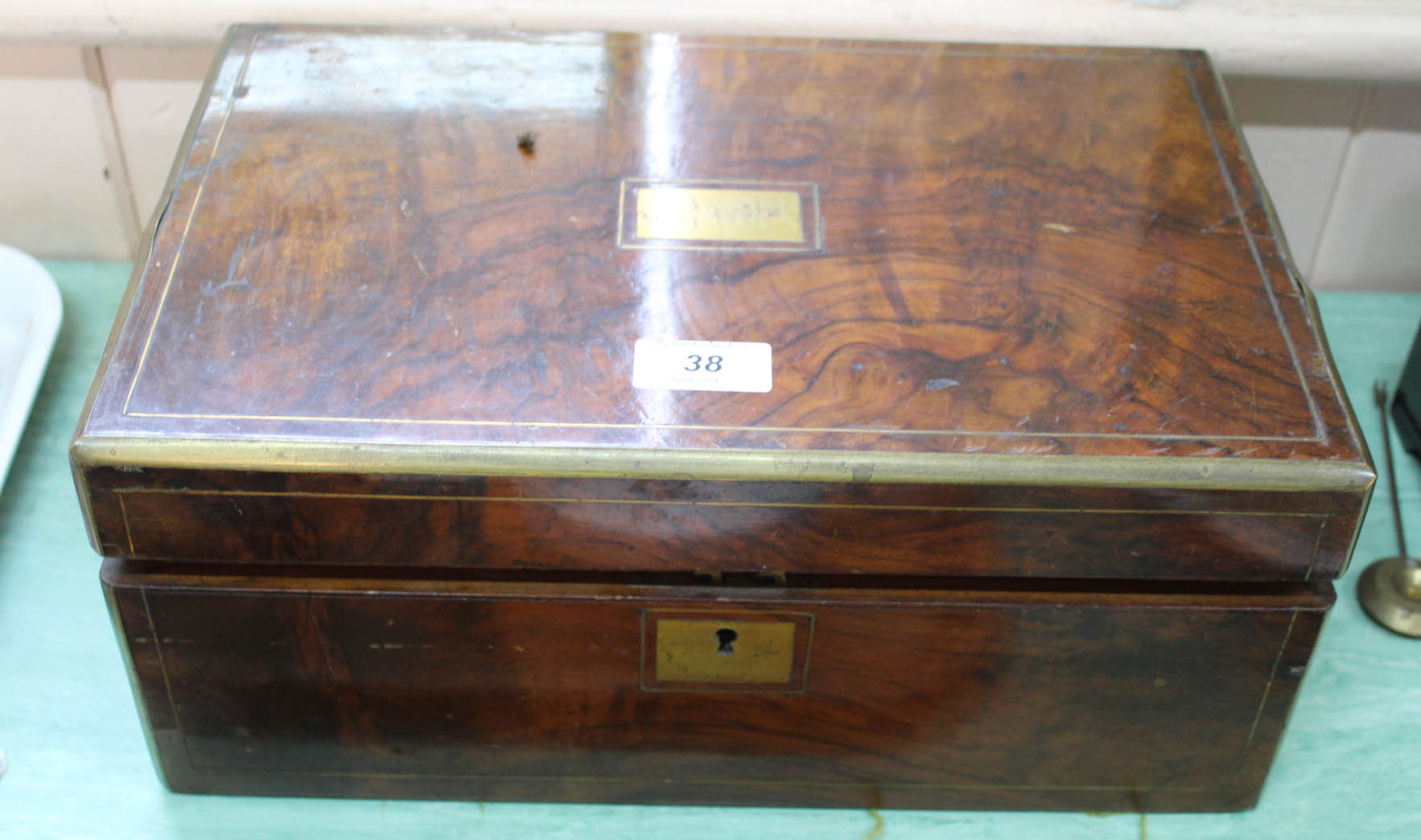 A Victorian walnut and brass bound writing slope