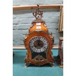 A reproduction French style kingwood and gilt metal waisted mantel clock with German movement