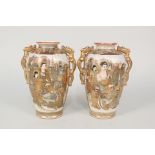 A pair of Satsuma vases with grim faced immortal decoration,