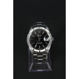 A gents stainless steel Rolex Oyster Perpetual watch with date aperture black dial,