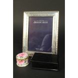 A silver photo frame by Carrs,