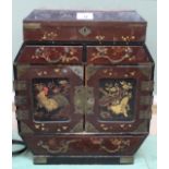 A Japanese lacquer bird and floral table cabinet