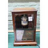 An Edwardian oak smokers cabinet with tobacco jar
