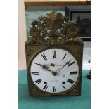 A 19th Century French wall clock with embossed brass front,