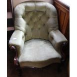 A late Victorian mahogany upholstered chair on brass castors