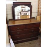 An Edwardian mahogany four drawer dressing chest