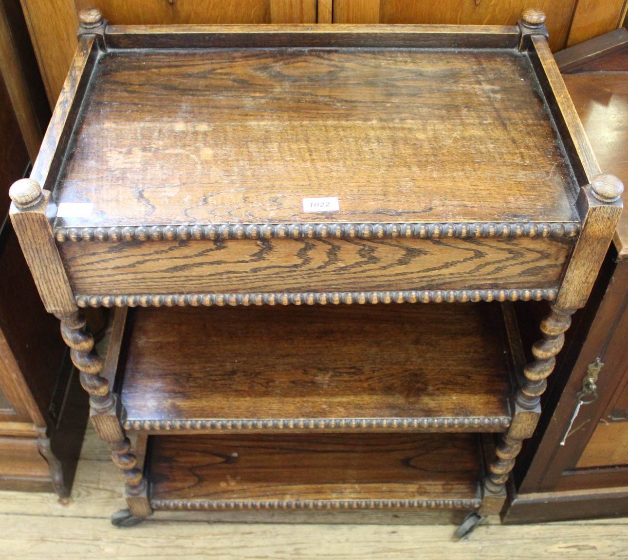 A 1920's oak barley twist hostess trolley with drawer