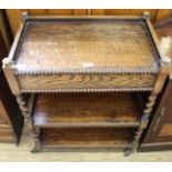 A 1920's oak barley twist hostess trolley with drawer