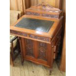 An Edwardian carved mahogany Davenport