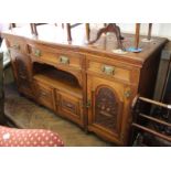 A large Edwardian oak sideboard with carved panels to doors (missing top)