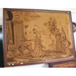 A large framed needlework depicting a Middle Eastern scene