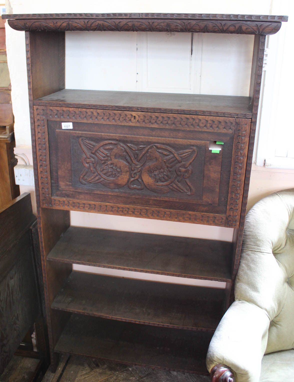 Unusual carved oak freestanding shelves with carved panel door