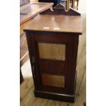 An Edwardian mahogany pot cupboard with inlaid panels to front