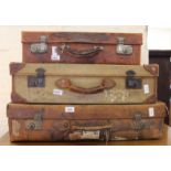 Three vintage suitcases of graduating sizes