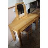 A modern oak dressing table with stool