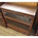 A Globe Wernicke style two tier sectional glazed cabinet with single drawer base