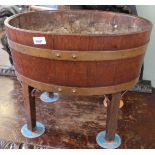 A 19th Century brass bound mahogany wine cooler on later added oak legs