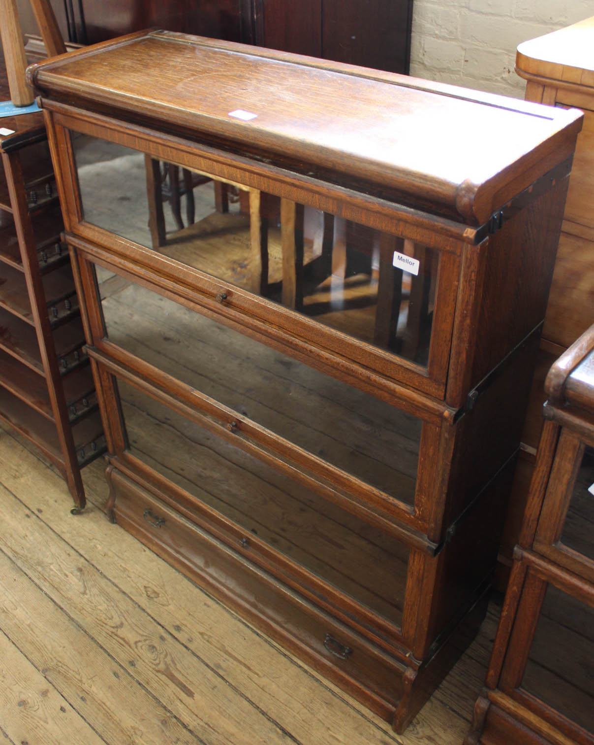 A Globe Wernicke style three tier glazed cabinet with one drawer base