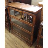 A Globe Wernicke style three tier glazed cabinet with one drawer base
