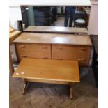 A 1960's four drawer mirrored sideboard with oak coffee table