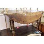 A 19th Century French circular drop leaf table