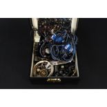 A black jewellery box and costume jewellery contents
