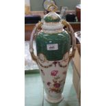 A German porcelain floral lidded vase with scale green decoration,