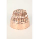 A Victorian circular copper jelly mould with finger style surround,
