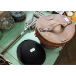 A leather hat box containing a French top hat,