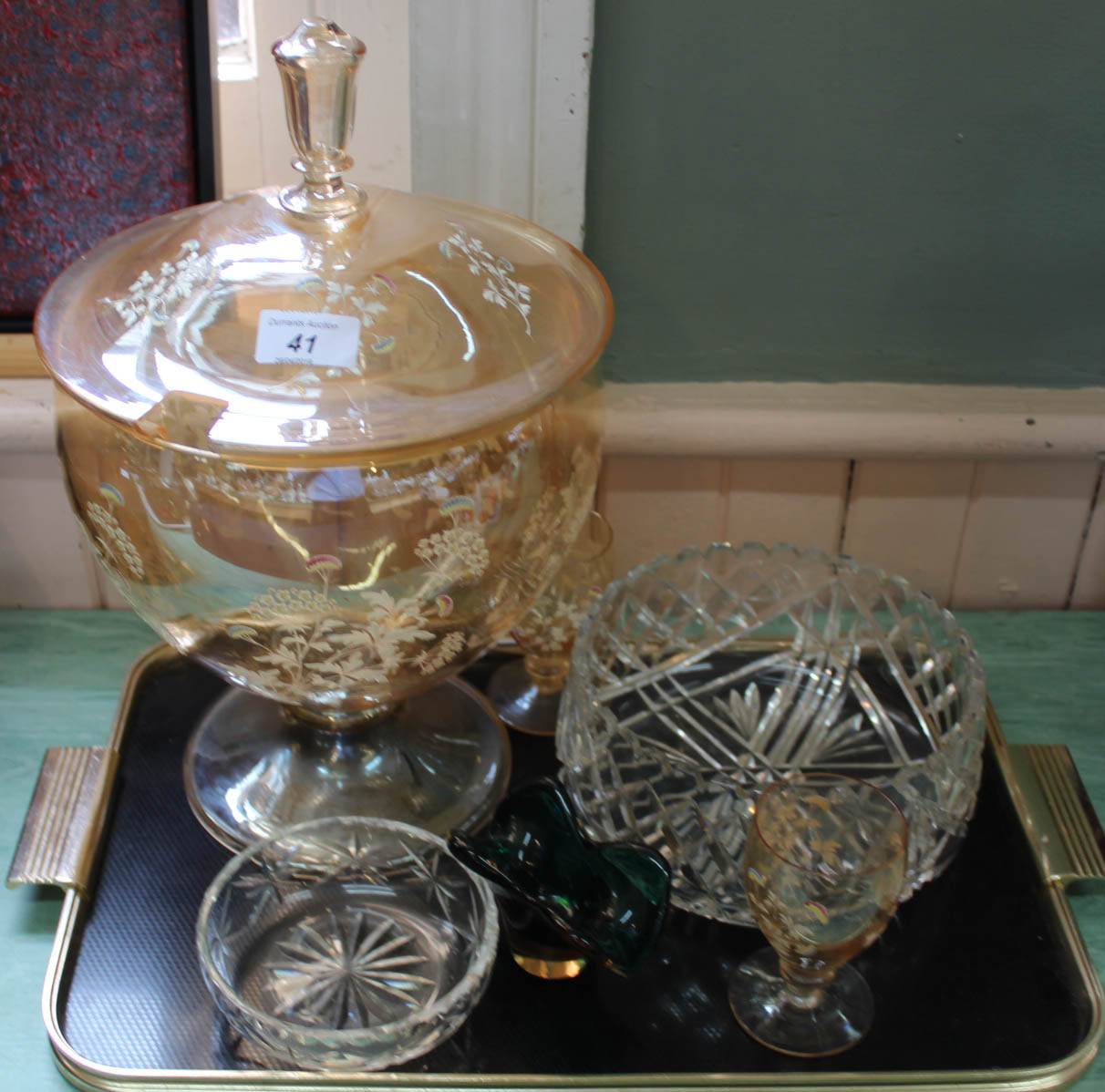 An orange glass punch bowl plus other glassware