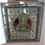 A stained glass panel depicting a Christian Saint (light restoration),