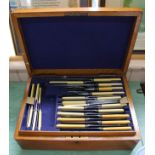 A oak cased part canteen of cutlery