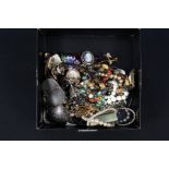 A box of costume jewellery including necklaces, brooches,