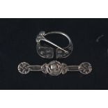 A silver Alexander Ritchie Iona Celtic pin together with a Scottish silver brooch with Viking ship