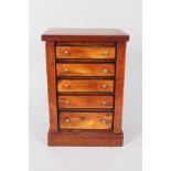A miniature fruit wood five drawer chest