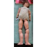 A porcelain head composition body doll,