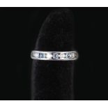 A 9ct white gold ring set with aquamarines and diamonds,