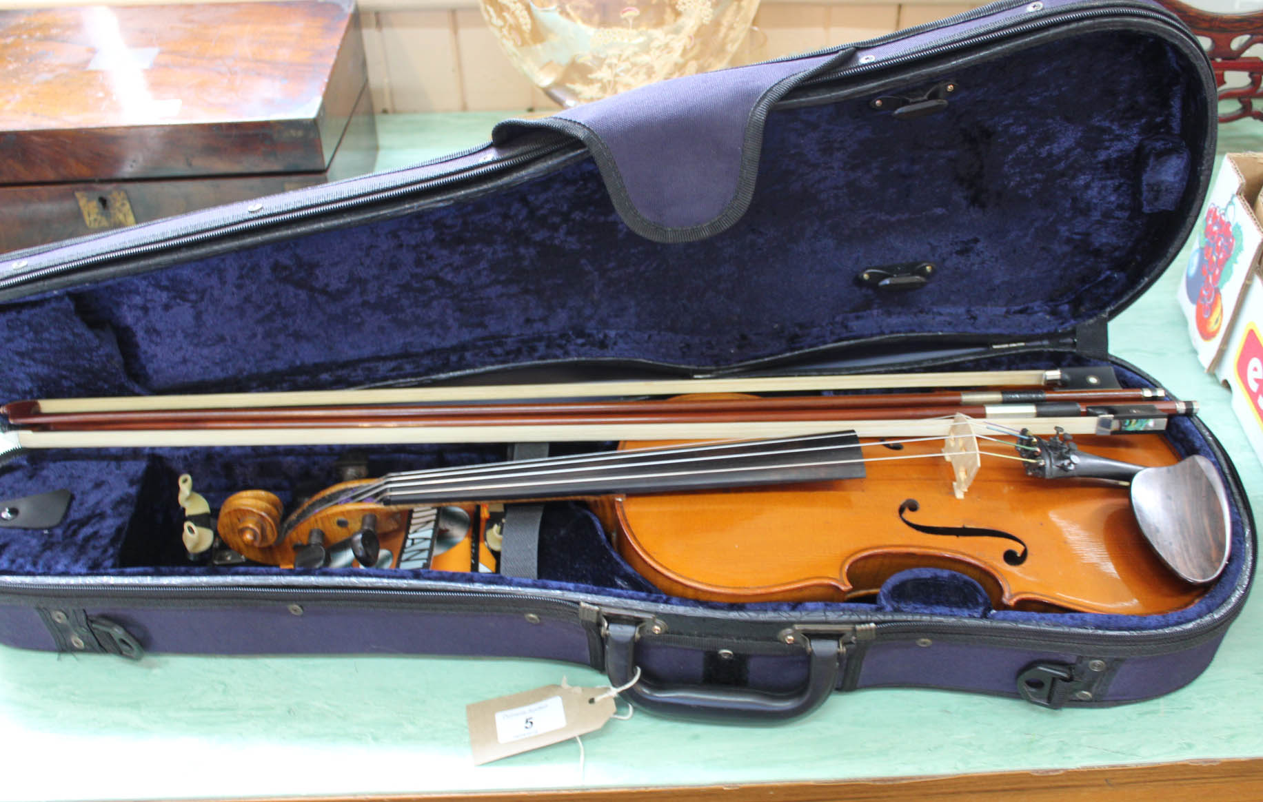 A cased German violin c1900 plus two bows
