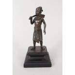 A bronze of a Dayak warrior,