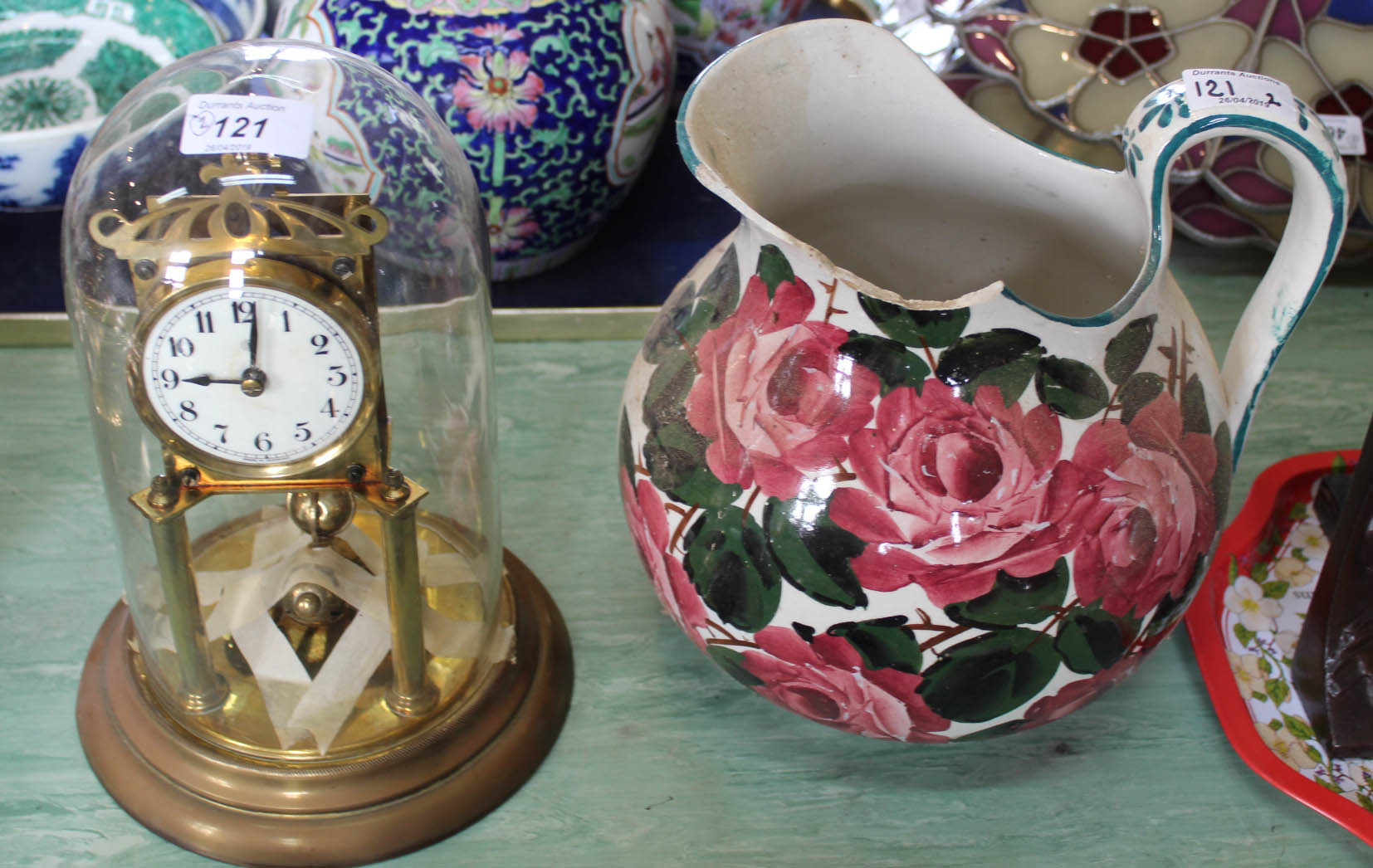 A Kienzle dome glass top clock plus a Wemyss jug (as found)