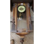 A mahogany striking wall clock