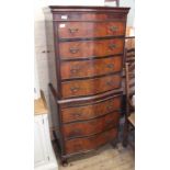 A reproduction mahogany small chest on chest with slide