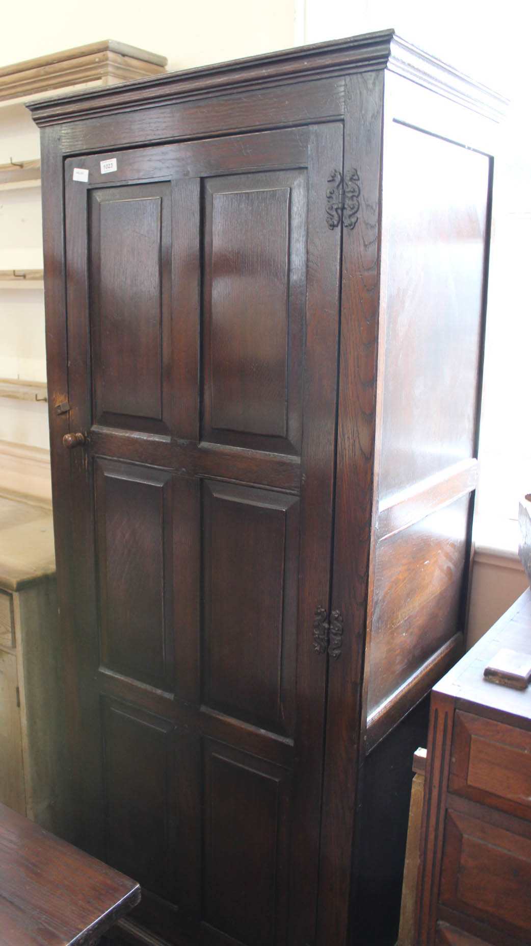 A 1920's oak one door cupboard