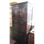 A 1920's oak one door cupboard