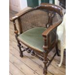 A late Victorian faux rosewood armchair