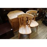 Two beech dining chairs and a modern pine one drawer cupboard