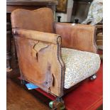 An unusual childs Edwardian leather and oak armchair (as found)